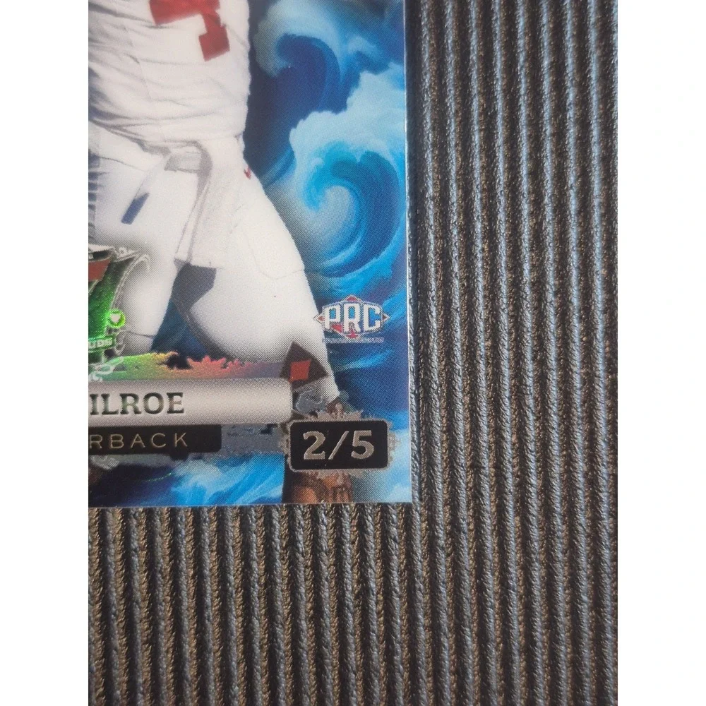 2024‎ Wild Card 7 Card Studs Jalen Milroe #CC7CW-JM Blue Rainbow Foil /5 (PRC)